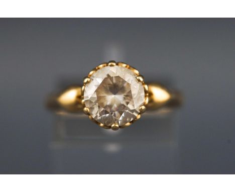 A yellow metal single stone ring. Set with a colourless round faceted cut cubic zirconia. Hallmarked 14ct gold, London. Stamp