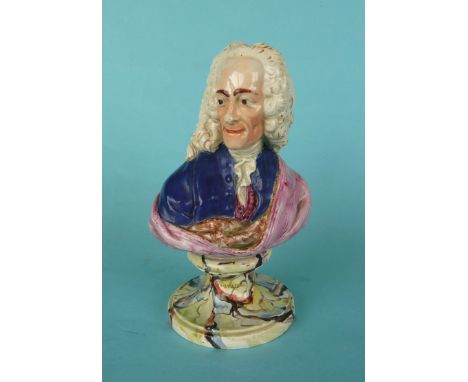 Voltaire: a good quality and colourfully enamelled Staffordshire pearlware portrait bust on integral named socle, circa 1790,