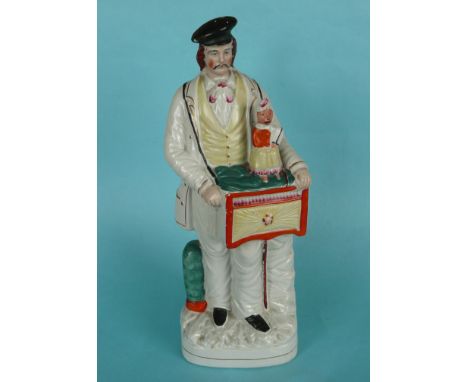 A good and colourful Staffordshire figure of an organ grinder with his monkey, circa 1850, 381mm(staffordshire pottery)