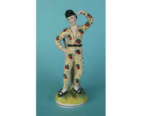 A rare Staffordshire figure by Thomas Parr of Harlequin, circa 1845, 184mm, baton restored * See Pugh E438 figure 248 where t