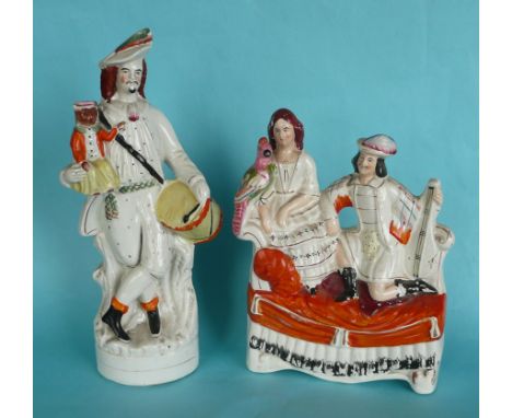 A good and colourful Staffordshire figure of a drummer with his monkey, circa 1880, 345mm and a group of a couple on a daybed