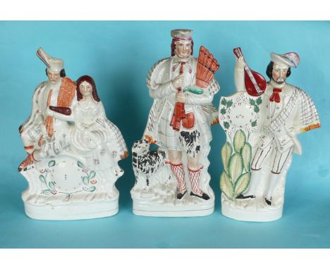 A colourful Staffordshire figure of a Highlander with bagpipes, circa 1870, 411mm, restored chip to hat and two clock groups,