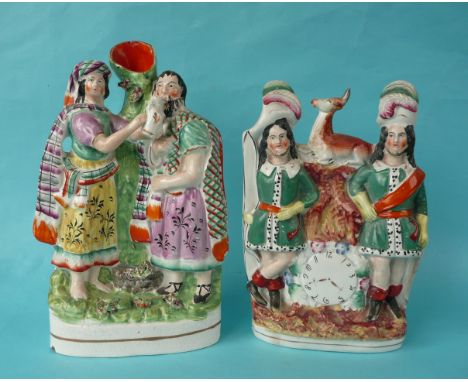A colourful Staffordshire pottery group depicting Highland figures at a well, chips to foot and vase spout, 280mm and a clock