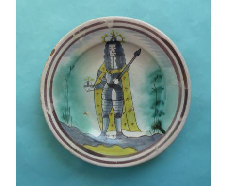 William III: a late-17th century English Delft dish well painted in magenta, blue, yellow and turquoise with a crowned full-l