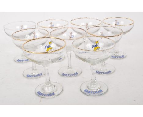 Babycham - A collection of nine 20th Century circa 1970s vintage Babycham coupe glasses. With gilt rim and advertising deer t