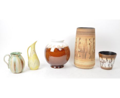 A collection of five late 20th-century studio pottery ceramic pieces, including a tall cylindrical vase, a squat vase, a cone