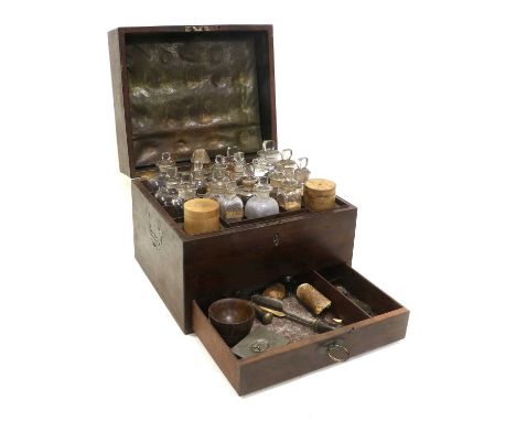 Apothecary Set in mahogany case with 18 glass bottles and two wooden boxes on top layer with legend in gold lettering listing