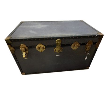 VINTAGE METAL BOUND TRAVEL TRUNKwith leather carrying handles, 53cm high x 92cm wide x 52cm deep