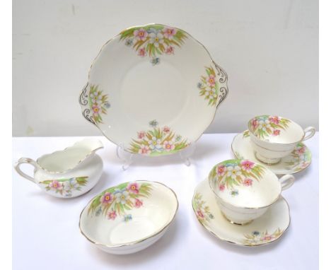 'ROYAL ALBERT' CHINA TEA SERVICEwith floral decoration on white ground, comprising six cups, six saucers, six side plates, ca