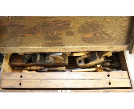 PINE TOOL CHESTwith brass capped corners and lift up lid revealing a selection of carpenters tools, 85cm wide 