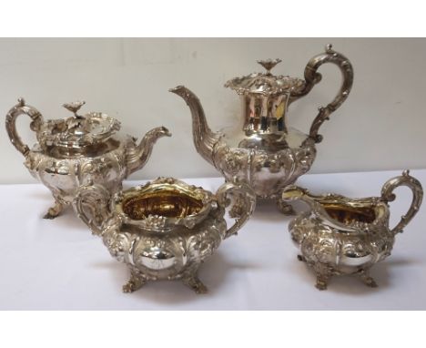 HIGHLY DECORATIVE WILLIAM IV AND VICTORIAN SILVER TEA SERVICEcomprising a tea pot, hot water jug, twin handled sugar basin an