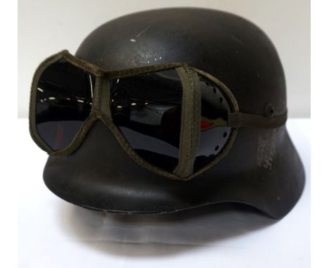 WWII STYLE GERMAN M35 STEEL HELMETwith Army double decals, the liner marked 'Heisler, Berlin C2', with adjustable leather chi