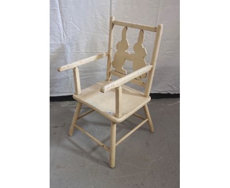 VINTAGE PAINTED PINE CHILD'S CHAIRthe backrest shaped as rabbits, with armrests and raised on turned legs with stretchers