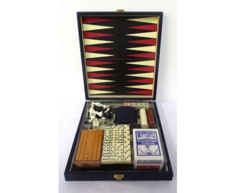 CASED GAMES COMPENDIUMopening to reveal a backgammon and chess/draughts board, poker dice, draught and chess pieces, cribbage