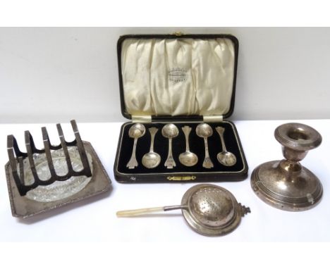 MIXED LOT OF SILVERincluding a squat chamber stick, Birmingham 1942; a circular tea strainer with a mother of pearl handle, B