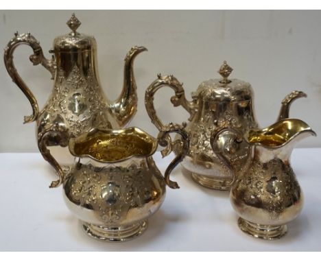 VICTORIAN SILVER FOUR PIECE TEA SERVICEcomprising a tea pot, hot water jug, milk jug and twin handled sugar basin, decorated 