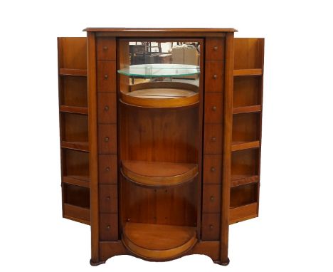 ITALIAN CHERRY DRINKS CABINETwith a moulded top above a central revolving dummy front, flanked by dummy drawers to each side 