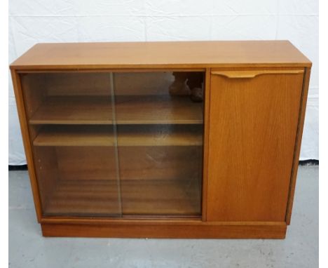 RETRO TEAK SIDE CABINETwith a pair of sliding glass doors enclosing adjustable shelves and a cupboard door opening to reveali