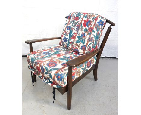 ERCOL STYLE ARM CHAIRwith a shaped top rail above a stick back and outswept arms, with a floral covered loose back and seat c