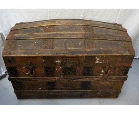 VINTAGE WOODEN AND LEATHER BOUND TRAVEL TRUNKlabelled 'G.G.Peterkin, Aberdeen', with leather carrying handles, 33cm high x 96