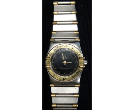 LADIES OMEGA CONSTELLATION BI-METAL WRISTWATCHthe black dial with button five minute markers and bezel set with Roman numeral