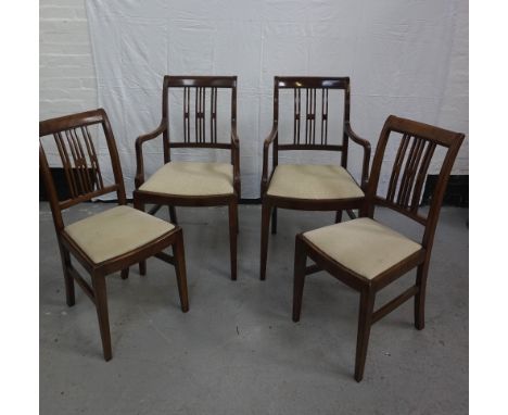 SET OF TWELVE MAHOGANY DINING CHAIRScomprising ten single and two carvers, with shaped and beaded top rails above a geometric