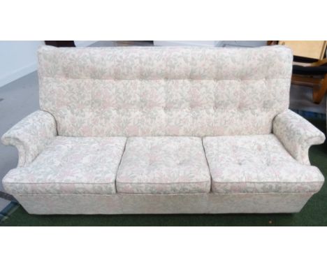 'PARKER KNOLL' THREE PIECE SUITEcomprising a three seat sofa with a button back above shaped arms and button seat cushions an