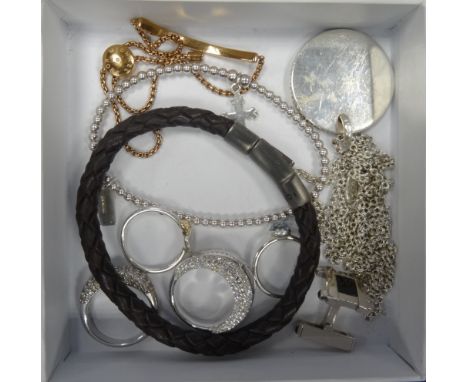 SELECTION OF DESIGNER AND FASHION JEWELLERYcomprising a single Cartier silver cufflink, a Links of London circular pendant on