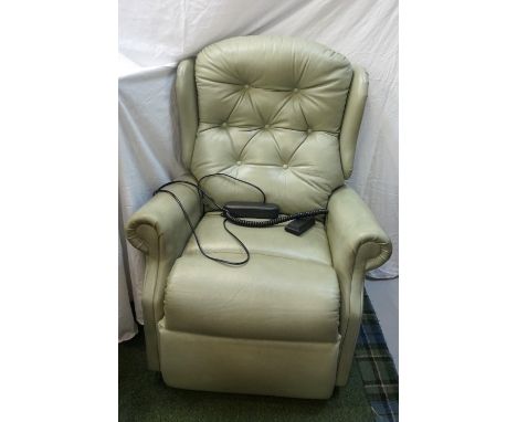 OKIN CELEBRITY ELECTRIC RISE AND RECLINE ARMCHAIRwith a button back and scroll arms, covered in green leather