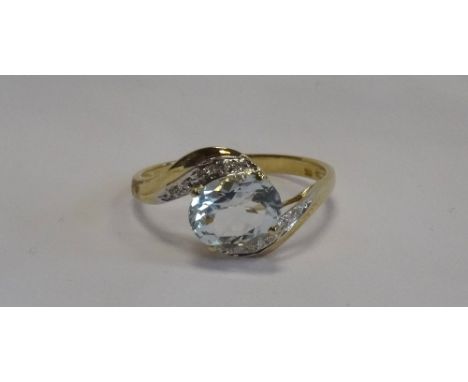 AQUAMARINE AND DIAMOND TWIST DESIGN RINGthe central oval cut aquamarine approximately 1.5cts flanked by small diamonds, on ni