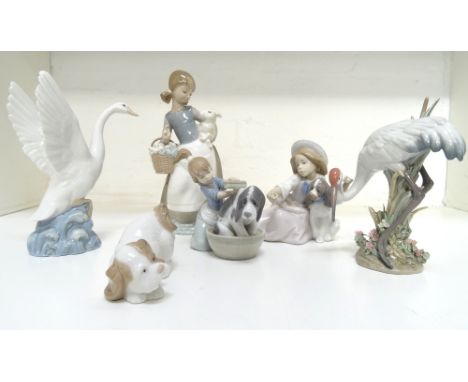 SELECTION OF LLADRO PORCELAIN FIGURESincluding a young girl with a basket of flowers and a lamb, 24.5cm high; a young girl ba