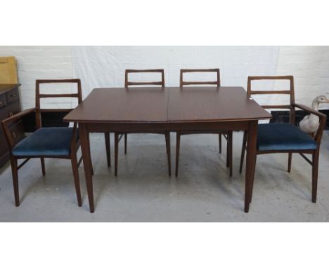 RETRO STAINED TEAK DINING ROOM SUITEcomprising an extending dining table with an extra leaf, standing on tapering supports, 1