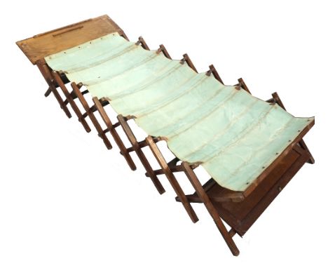 VINTAGE PINE FRAMED FOLDING CAMPAIGN BEDwith fitted canvas sheet, 210cm long (extended) x 87.5cm wide