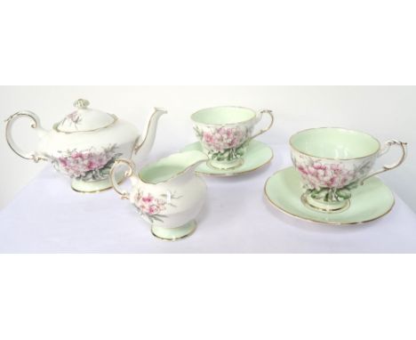 'PARAGON' CHINA TEA FOR TWO SERVICEwith floral decoration on white ground, comprising teapot, two cups, two saucers, small si