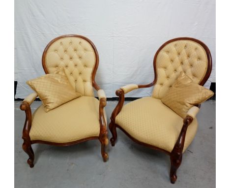 PAIR OF VICTORIAN STYLE ELBOW CHAIRSwith shaped frames, in beige coloured fabric with button-back detail to backrests, raised