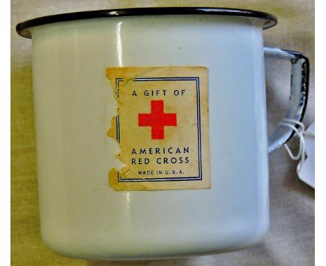 American WWII Red Cross enamel mug, "A gift of American Red Cross Made in U.S.A." with its original paper tag still attached.