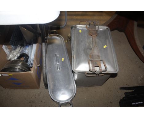 A stainless steel fish kettle and a twin handled pot and cover 