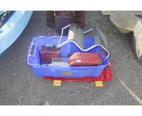 A plastic storage box containing fuel cans, spirit level, caravan steps etc. 