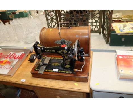 A Singer sewing machine in case