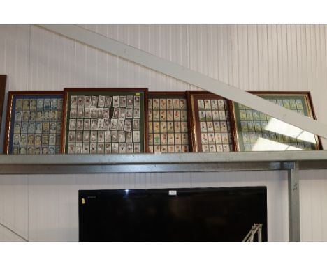 Five framed and glazed cigarette card collections of footballers, rugby players and cricketers