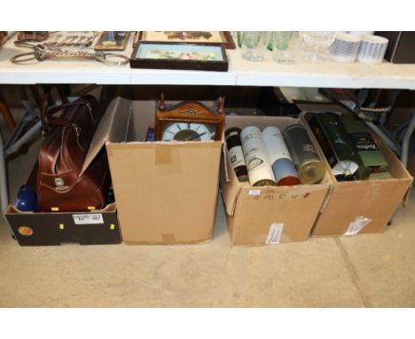 A collection of whisky bottle tins and boxes; a clock; an Antler holdall; kitchenalia etc.