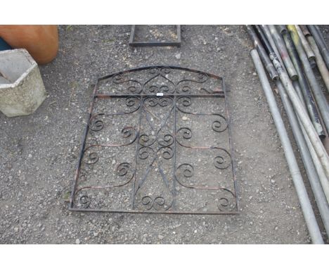A wrought iron garden gate