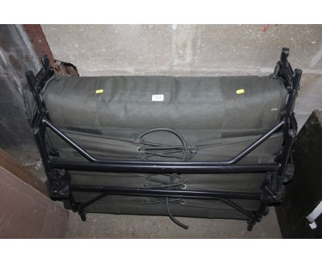 A Nash Indulgence Sleep system fishing chair / bed 