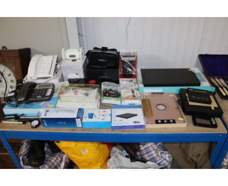 A quantity of various domestic items to include hand operated egg whisk, battery charger and tester, push button telephones e