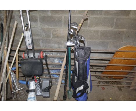A hand scythe; a snooker cue in metal case; a long handled trowel and a golf bag and clubs 