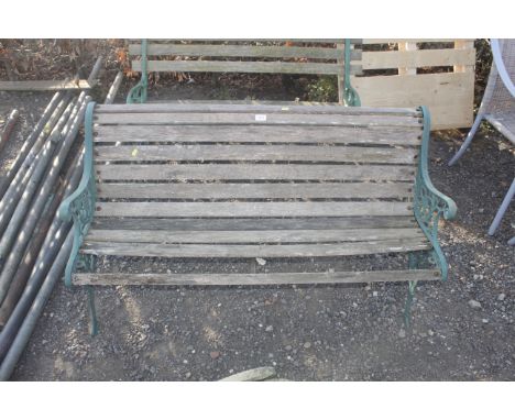 A wooden and metal garden bench AF