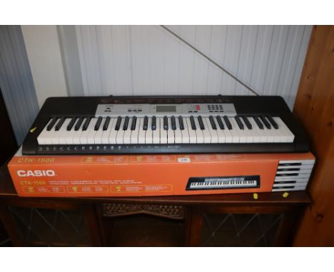 A Casio CTK-1500 keyboard and box