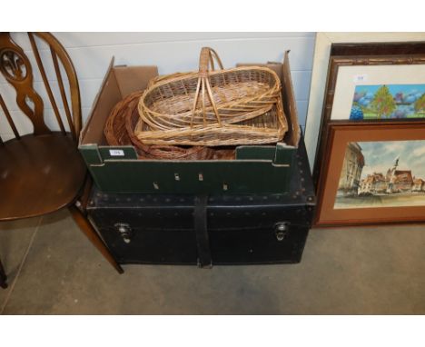 A laundry trunk and a quantity of wicker baskets