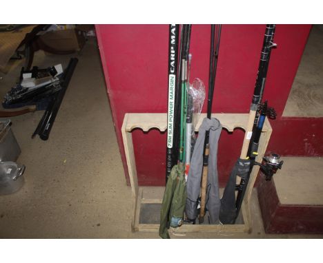 A Leeda Carp Match fishing rod; a carp landing net; a Greys Prodigy three piece fishing rod and a Tokox three piece fishing r