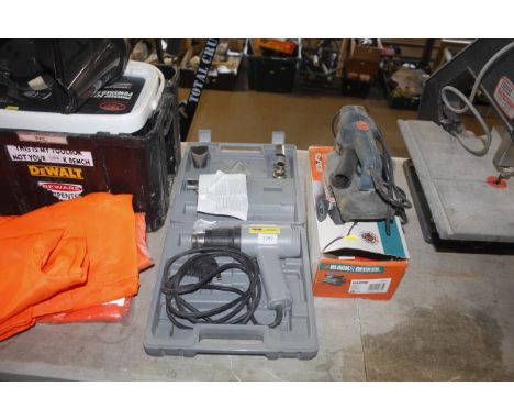 A heat gun and a Black & Decker sander 